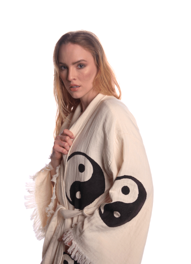 Close-up of reversible jacquard weave Yin Yang kimono, soft organic Turkish cotton texture.