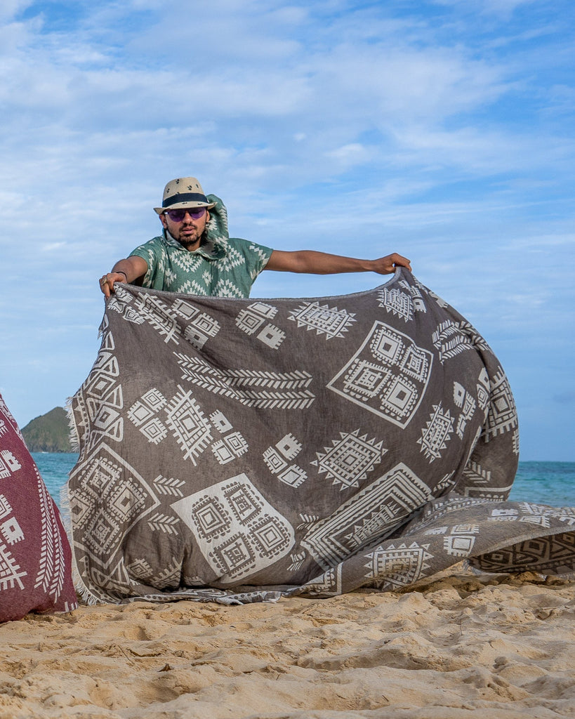 Close-up of sand boho geometric weave showing the soft texture of the organic cotton blanket