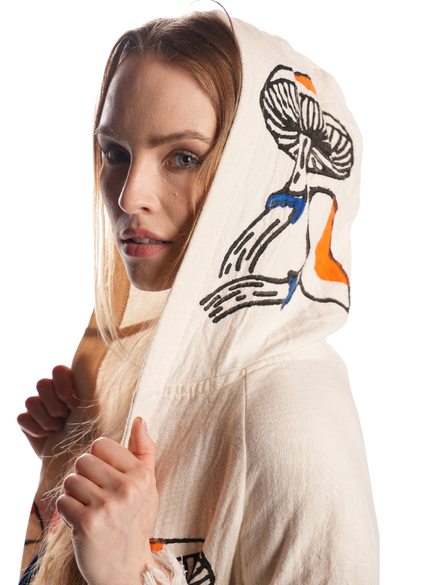 Close-up of the reversible mushroom jacquard weave — premium organic cotton texture with detailed artisanal stitching.