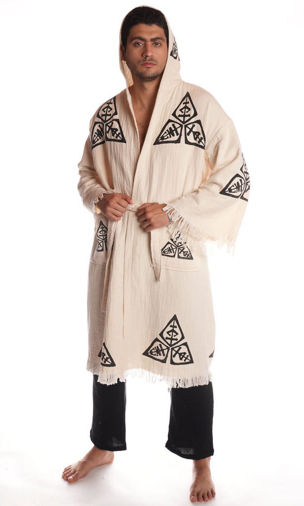 Male model wearing the Veni Vidi Vici hooded kimono, unisex boho robe made from 100% organic Turkish cotton with artisan geometric embroidery.