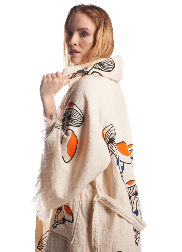 Relaxed lifestyle moment wearing the Mushroom Kimono — cozy, breathable, reversible cotton kimono for travel and daily style.