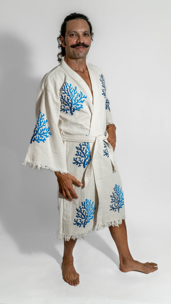 Man in Reef Kimono showing front view with blue coral artwork, styled in a premium handcrafted design.